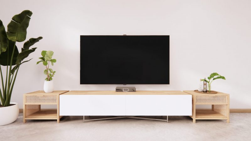 Salon moderne équipé d'un meuble télé d'occasion acheté en ligne, mettant en valeur l'élégance et la fonctionnalité dans un espace de vie contemporain.